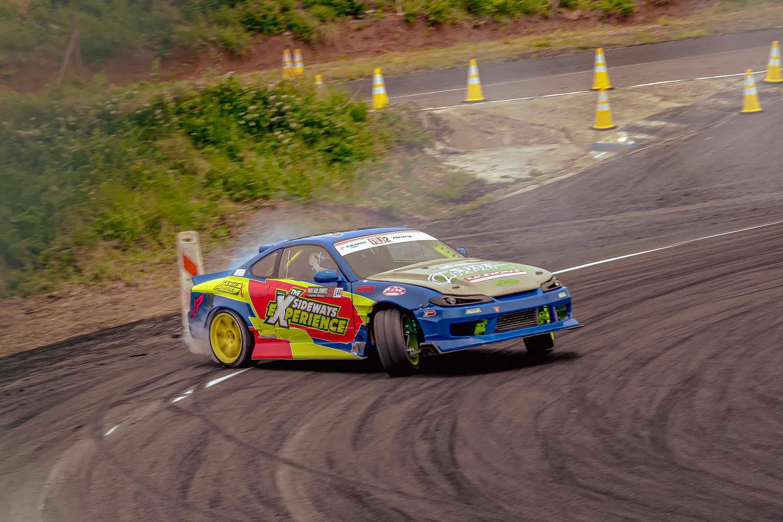 Car drifting with tyre smoke at Ebisu Circuit