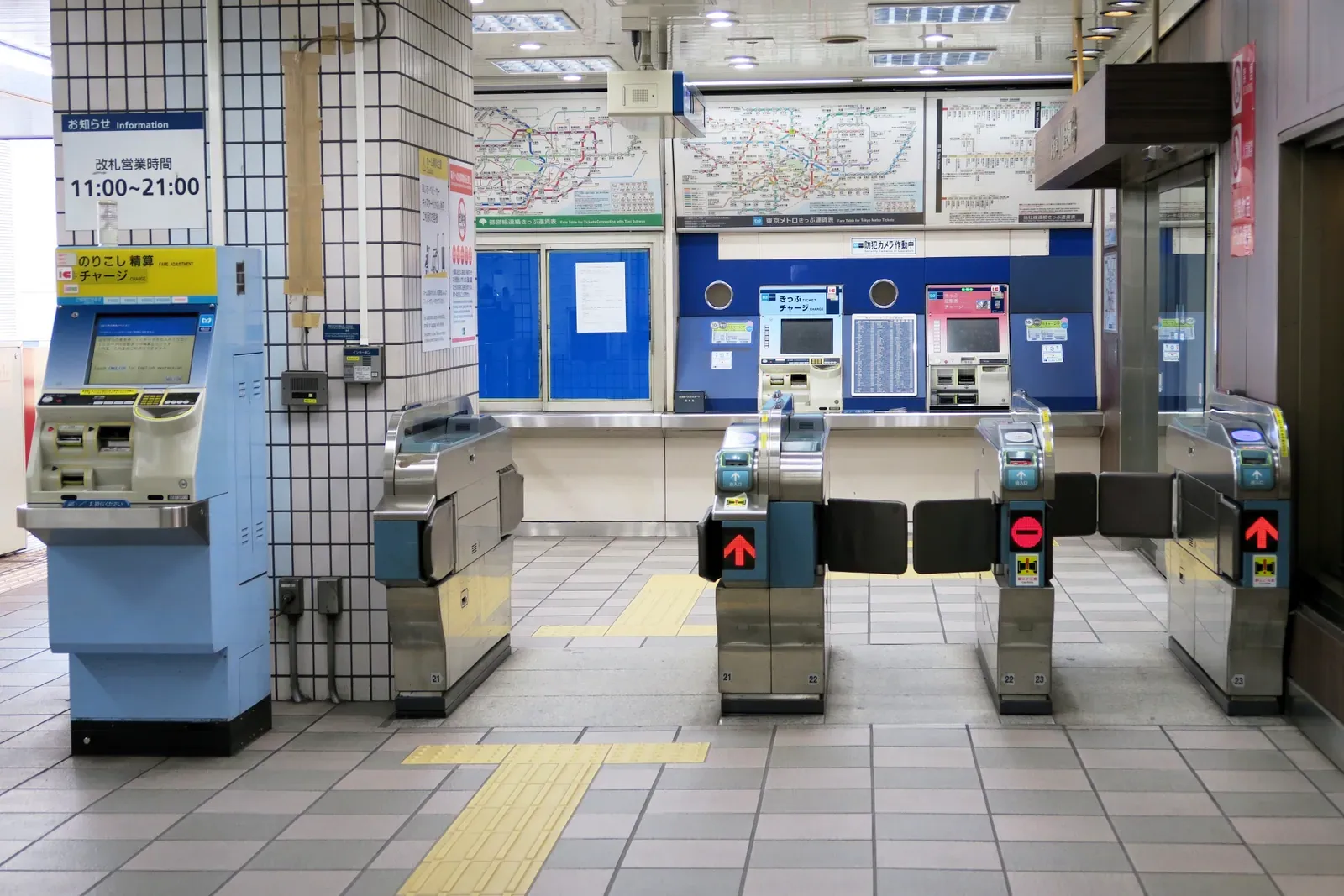 Station ticket gates and fare machines in a Japanese train station
